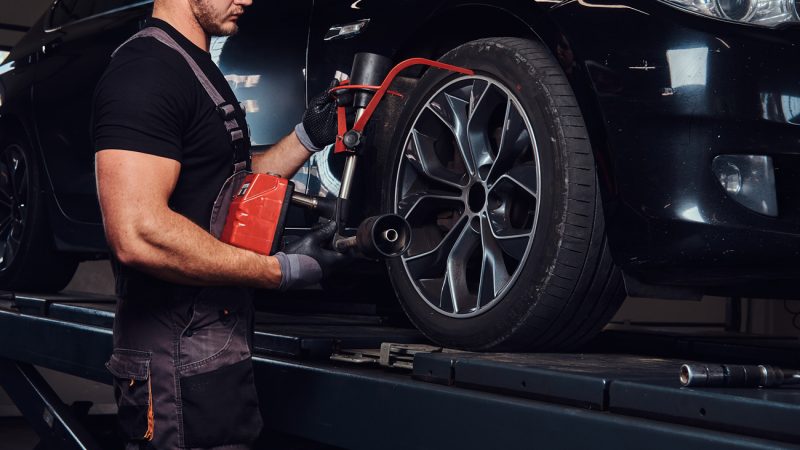 muscular-man-is-fixing-car-s-wheel-with-special-tool-auto-service (2) muscular-man-is-fixing-car-s-wheel-with-special-tool-auto-service (2)